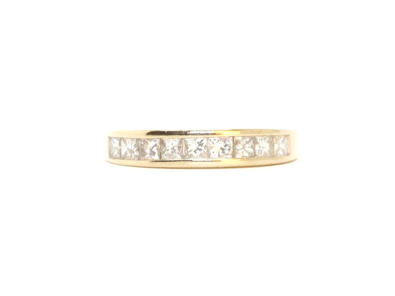 Lovely 18ct gold princess cut diamond half eternity ring, set with nine princess cut diamonds. Total diamond weight  0.77ct (stamped on band).