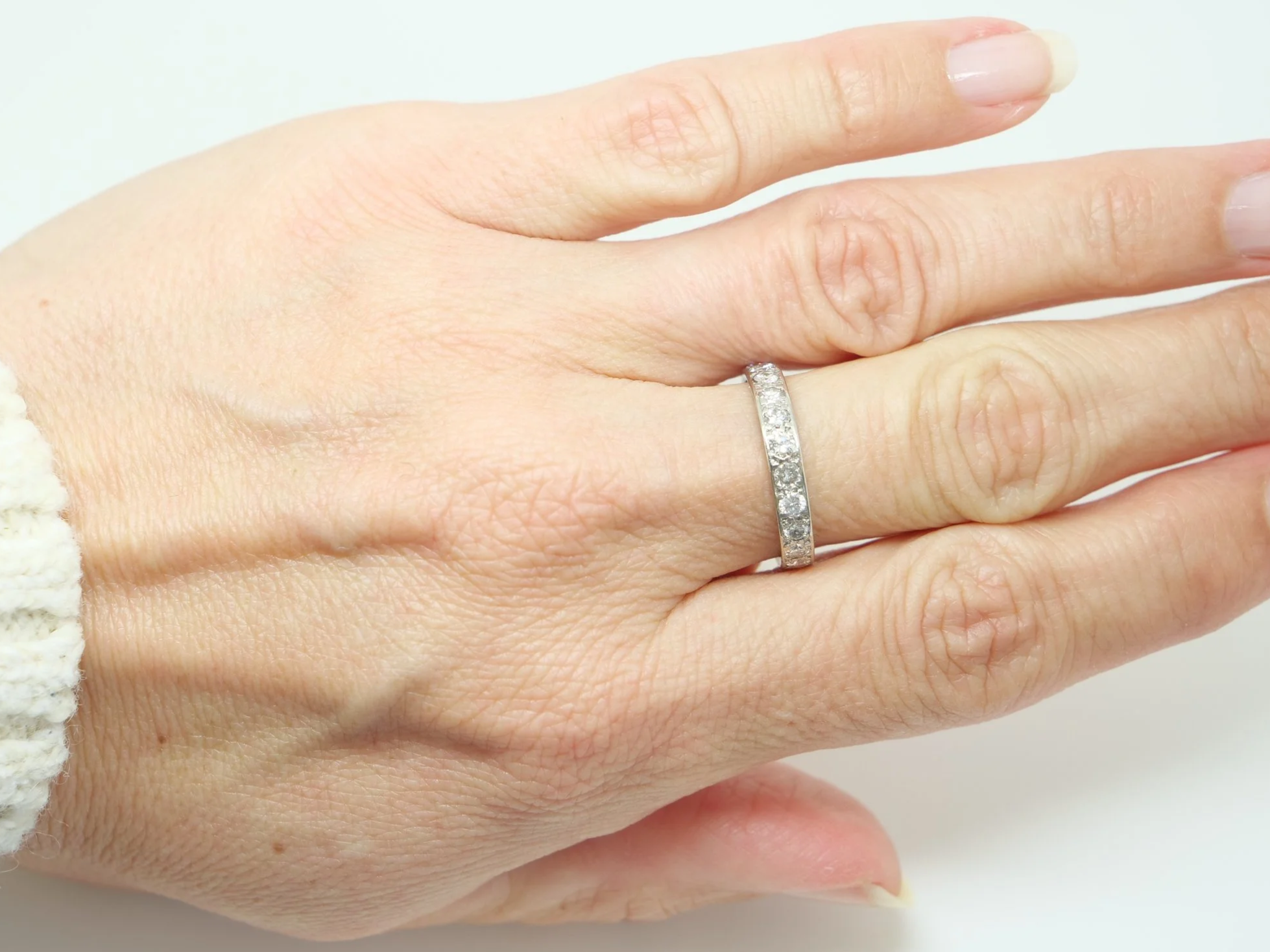 A vintage full eternity ring in 18ct white gold, set with round brilliant cut diamonds all the way around the band.