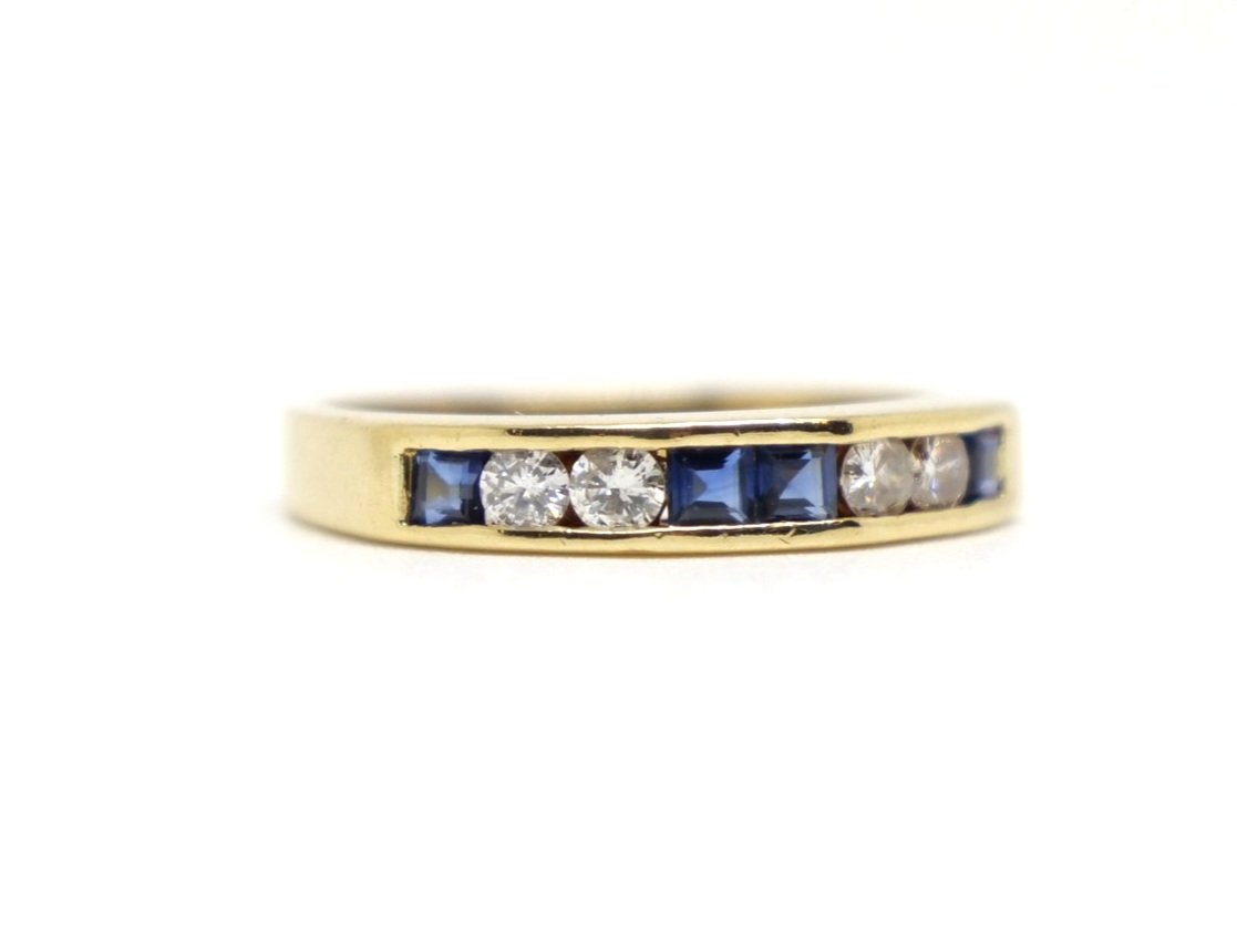 Lovely vintage 18ct gold sapphire and diamond half eternity ring, set with four step cut sapphires and four brilliant cut diamonds.