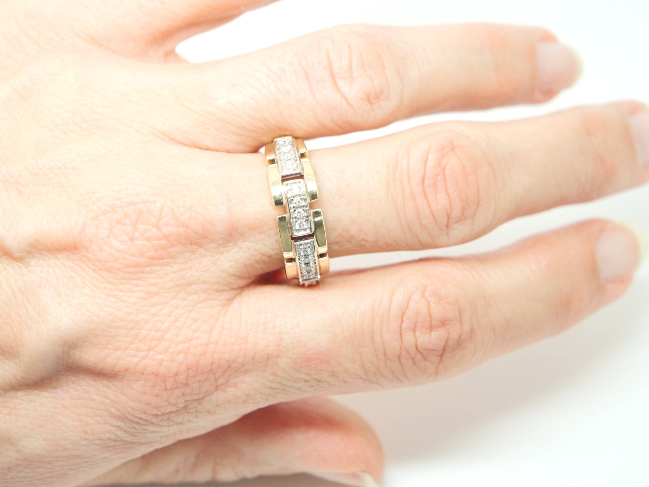 Designer style chunky vintage ring in 9ct gold, with a link design and set with four rows of diamonds. Diamonds 0.2ct total.