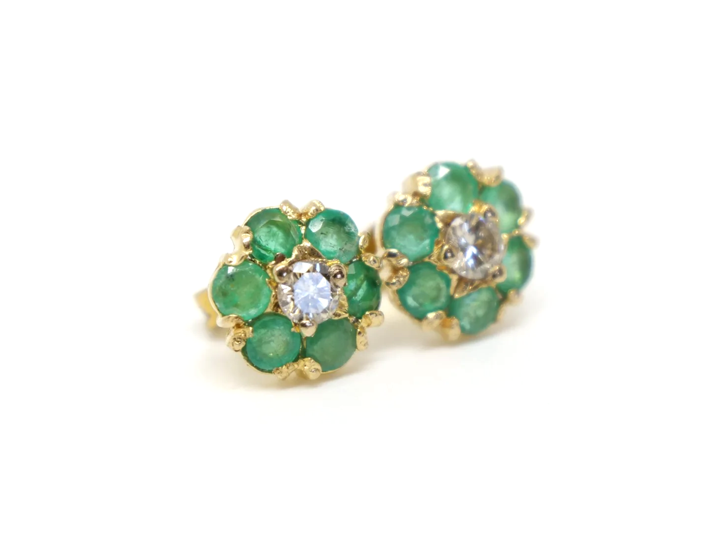 pretty pair of emerald and diamond daisy design vintage earrings in 9ct yellow gold, dating from 1975