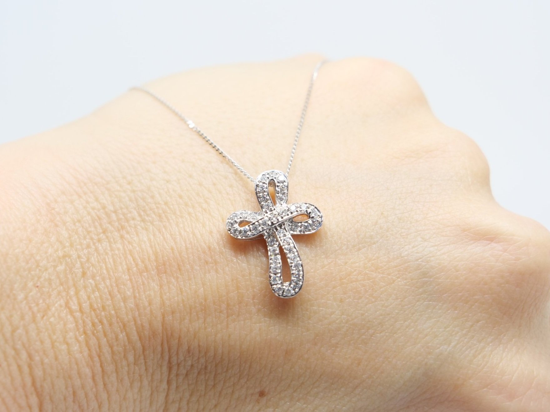 Stunning platinum diamond cross pendant, set with beautiful brilliant cut diamonds in this contemporary cross style design. With 16” 18ct white gold chain.