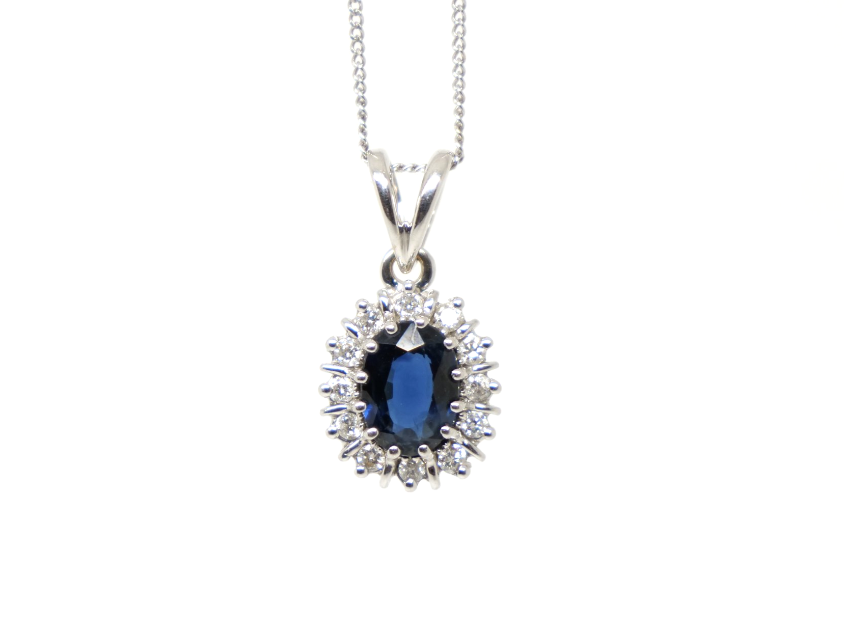 Lovely 18ct gold preloved sapphire and diamond pendant and chain, set with an approximately 1ct sapphire and surrounded by diamonds.