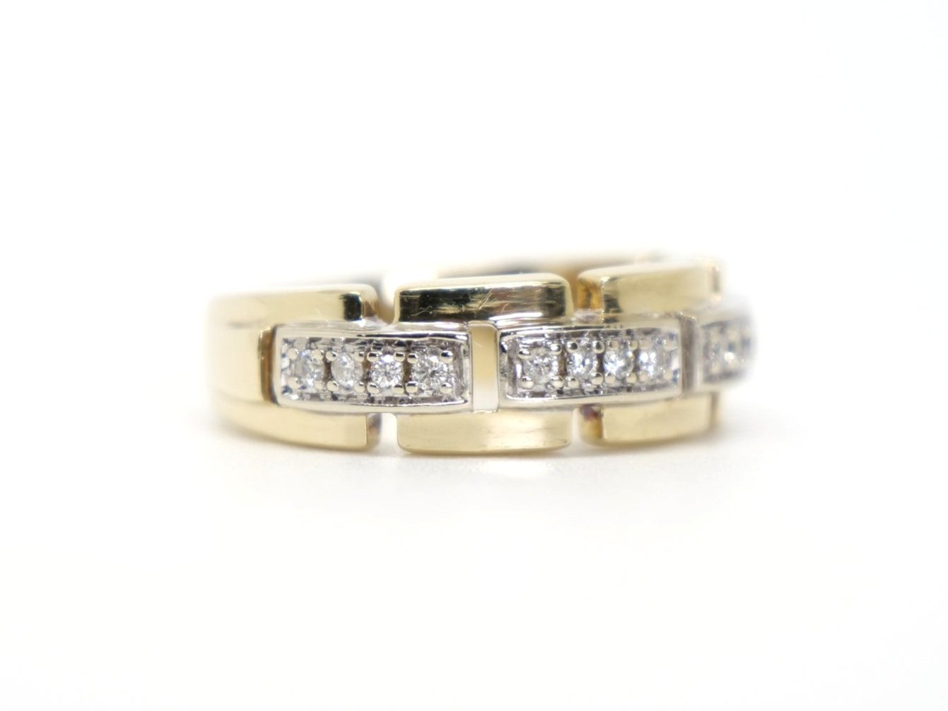 Designer style chunky vintage ring in 9ct gold, with a link design and set with four rows of diamonds. Diamonds 0.2ct total.