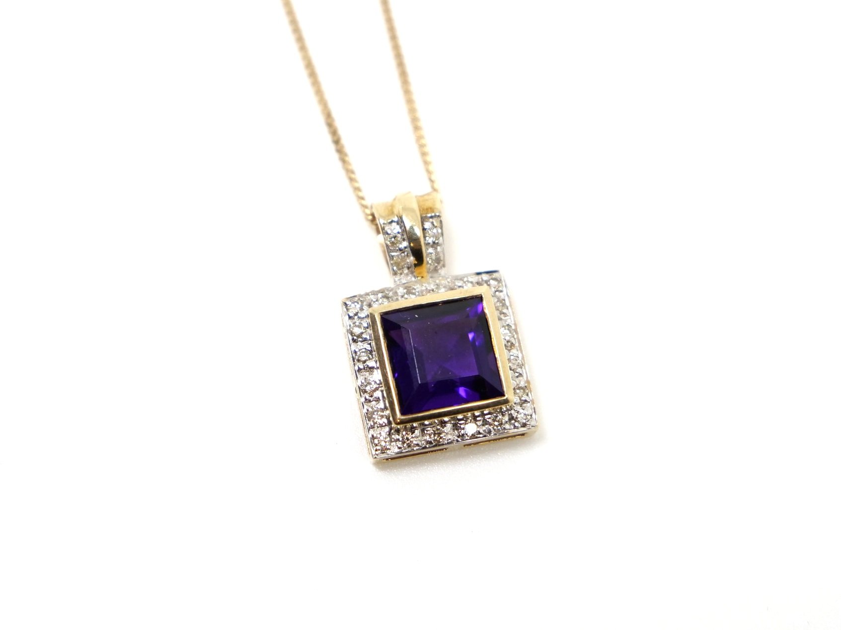 Lovely quality 9ct gold amethyst and diamond pendant in a square design, set with a beautiful deep purple amethyst and surrounded by diamonds.