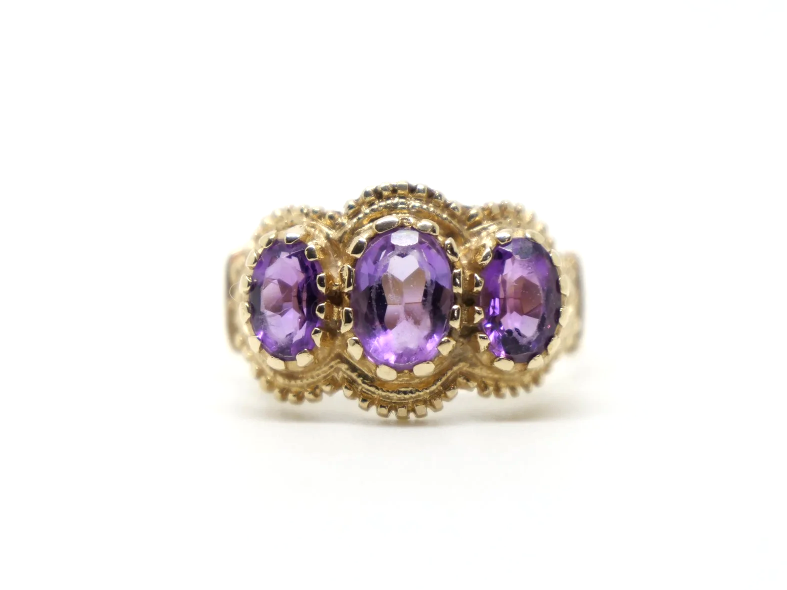 Gorgeous vintage 9ct gold amethyst cocktail ring, set with three lovely oval cut amethysts in this delightful gold detail design.