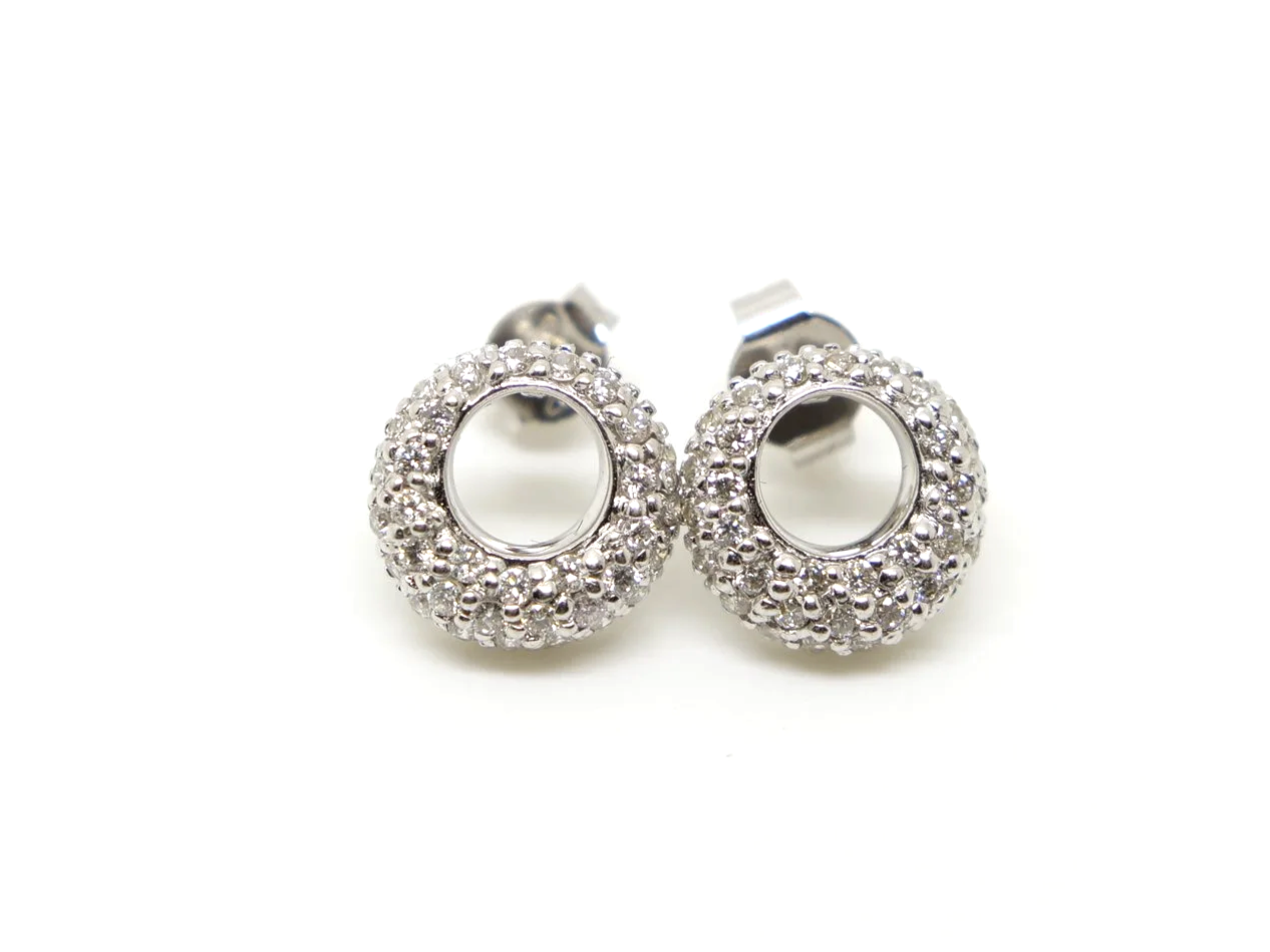 Sparkly 18ct gold circular design earrings set with small pave set diamonds. With 18ct gold earring backs.