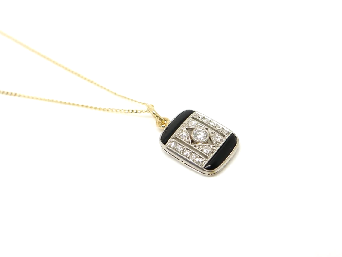 Art Deco onyx and diamond pendant, set in platinum and 18ct gold