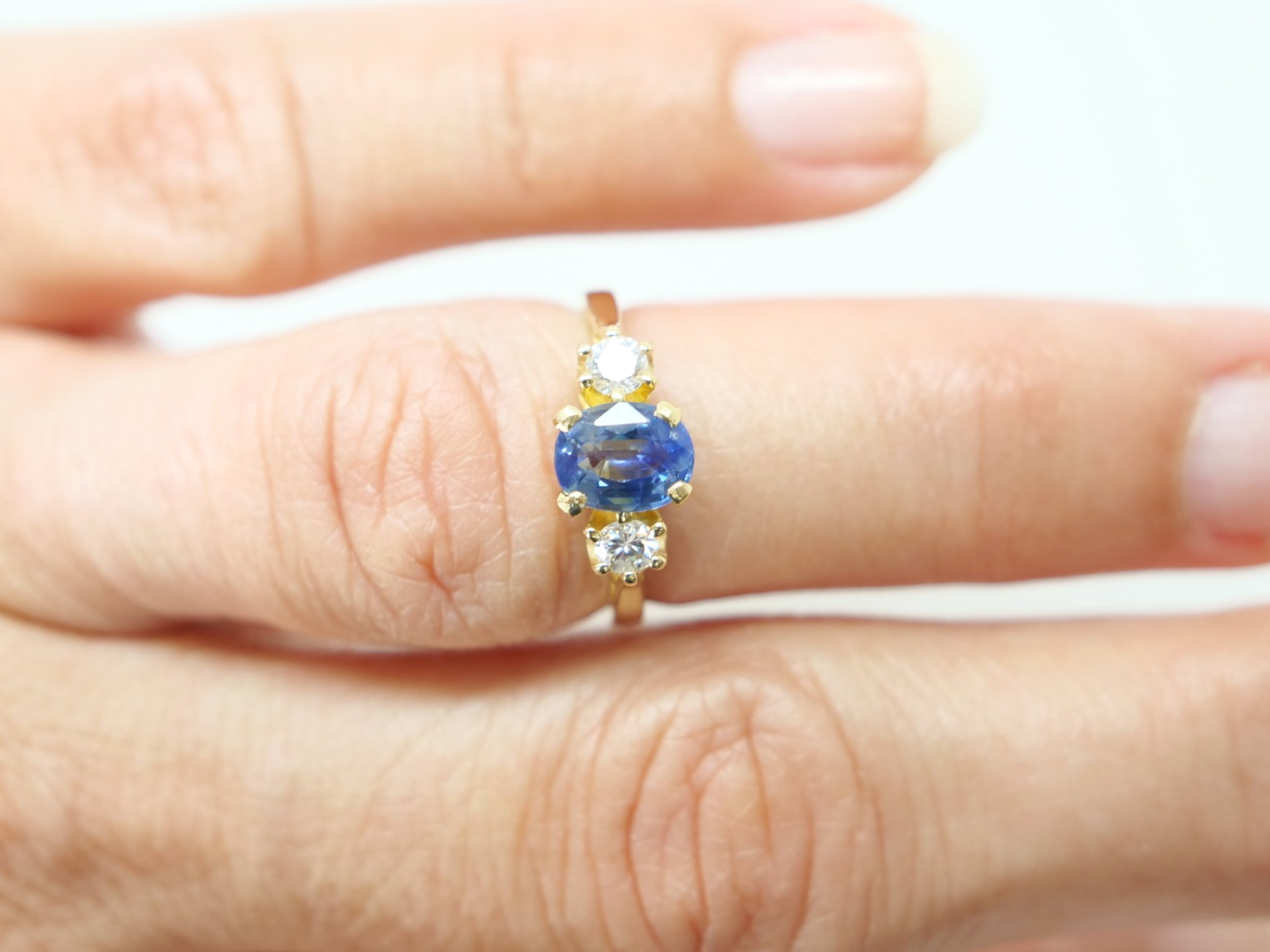 Lovely vintage 18ct gold sapphire and diamond trilogy ring, set with a 1ct oval cut emerald and with a brilliant cut diamond to each side.