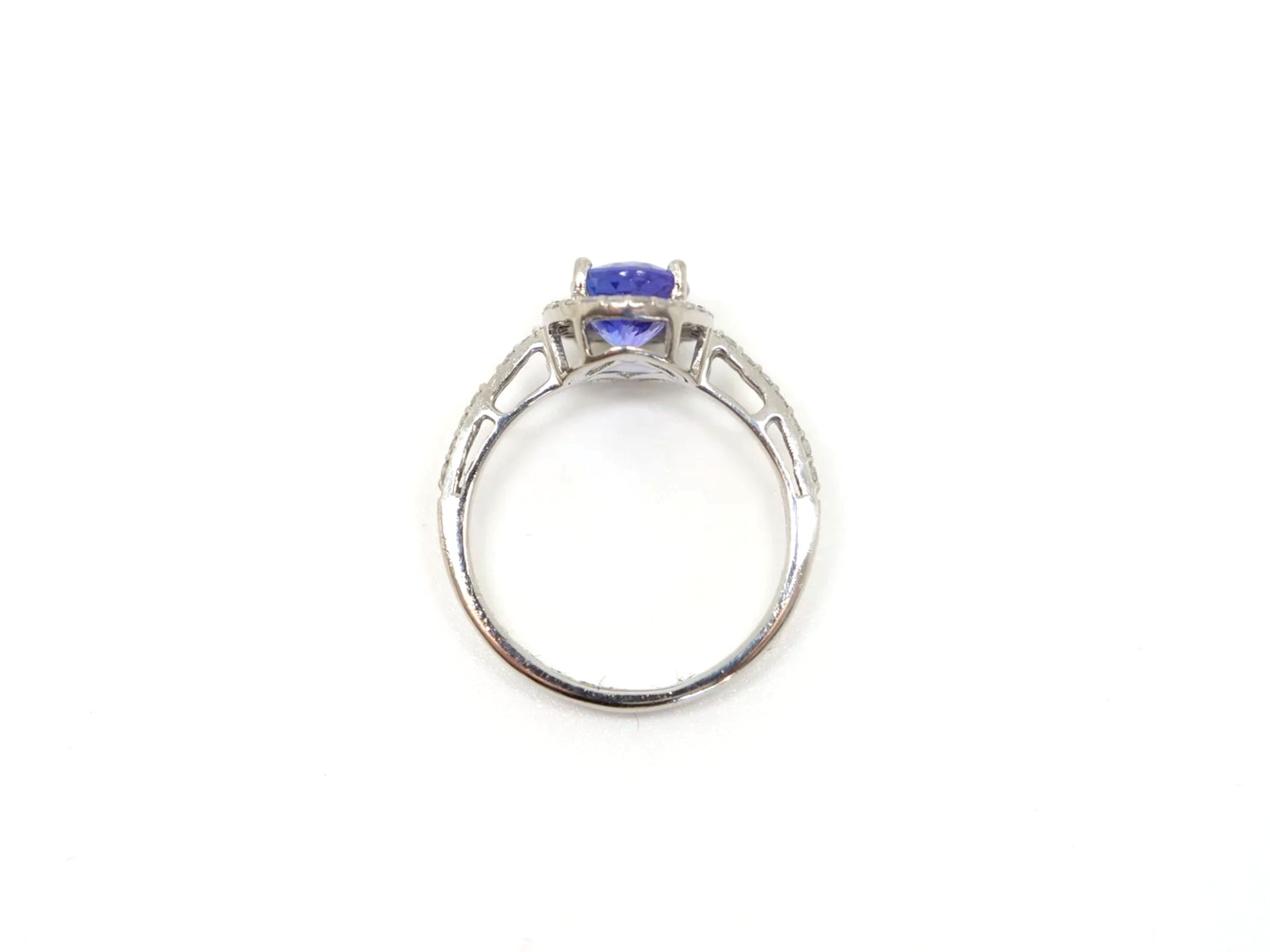 Platinum tanzanite and diamond halo ring, oval violet blue tanzanite with diamond halo, UK size M