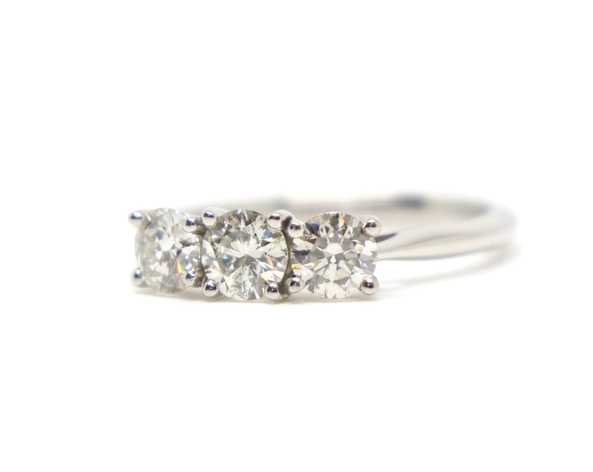 Stunning contemporary 1ct diamond three stone ring in platinum, set with three very sparkly, well matched brilliant cut diamonds.