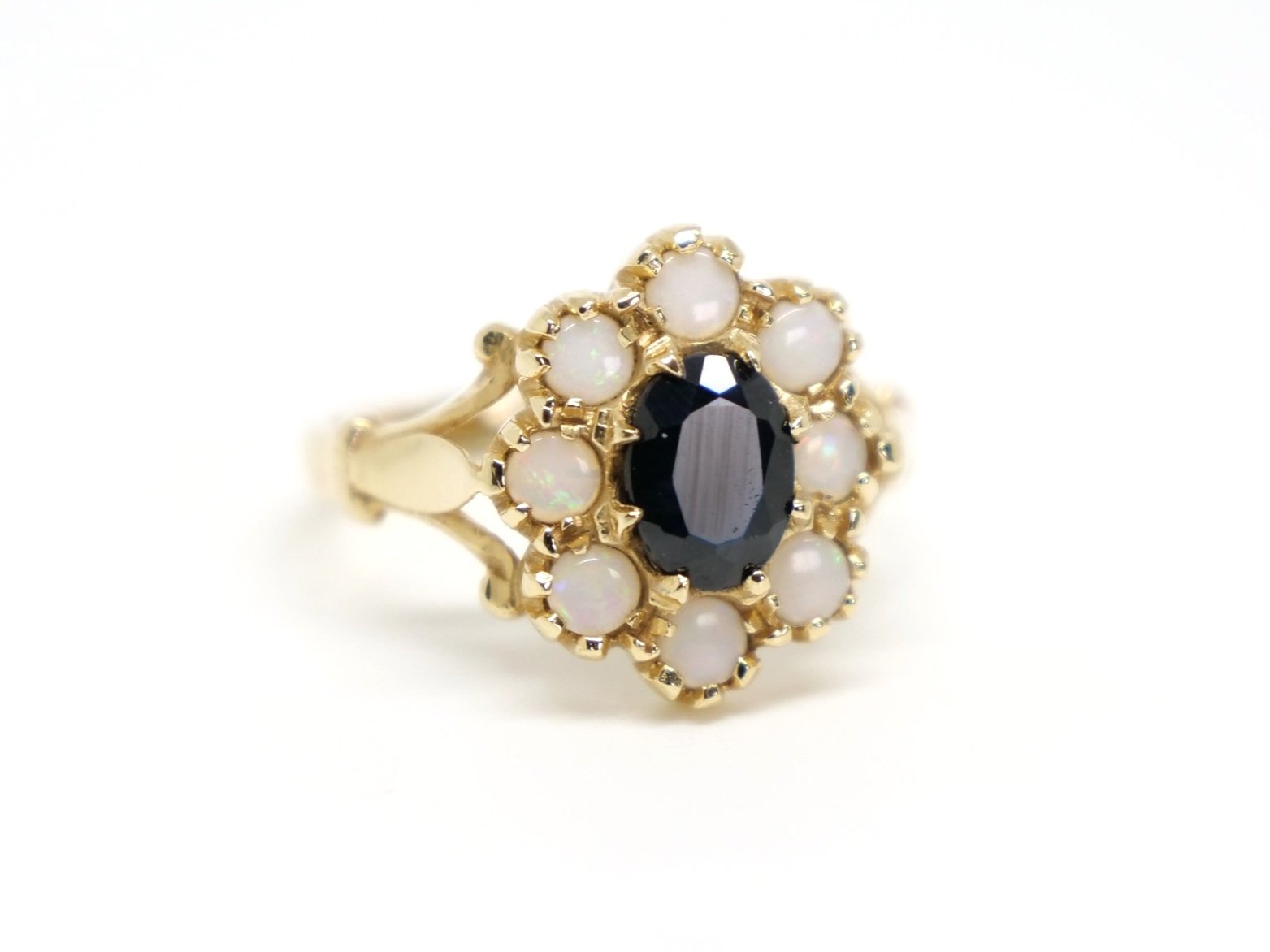 Super vintage 14ct gold sapphire and opal ring, set with a central approximately 1ct oval cut sapphire and surrounded by round cut opals.