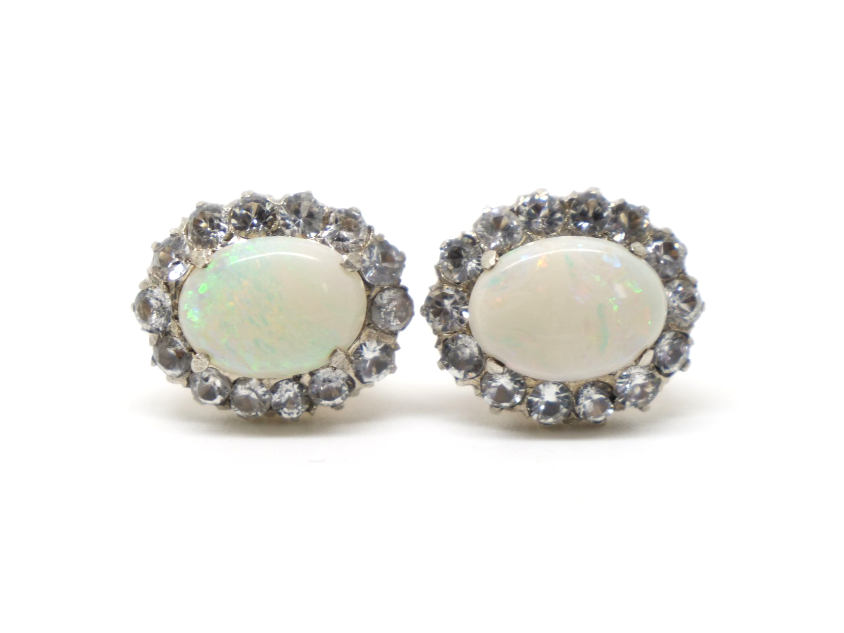 Beautiful 1930’s 9ct gold opal and white sapphire earrings, set with a large opal and surrounded by white sapphires.