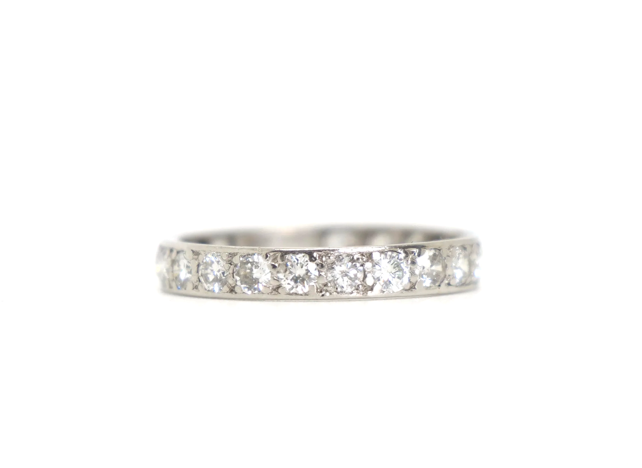 A vintage full eternity ring in 18ct white gold, set with round brilliant cut diamonds all the way around the band.