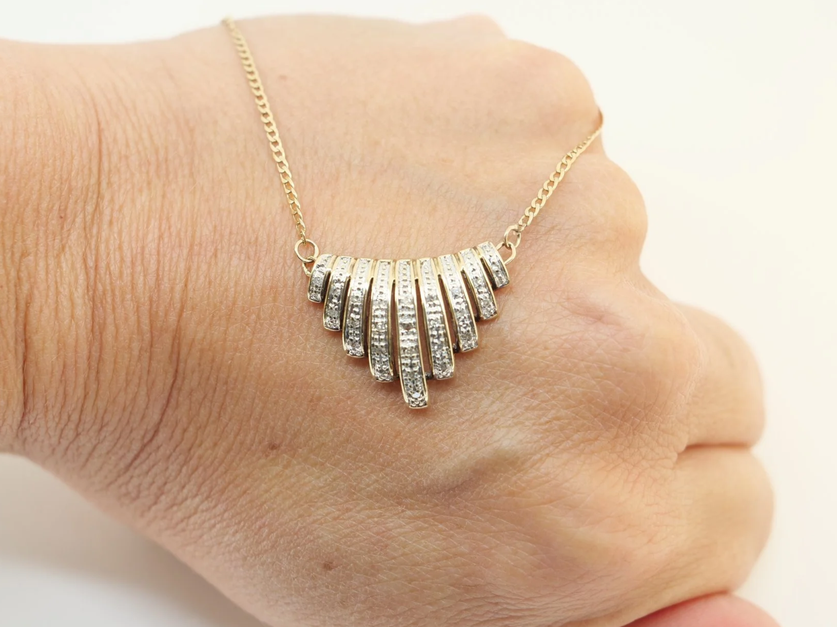 9ct gold diamond fan pendant necklace, graduated bar design