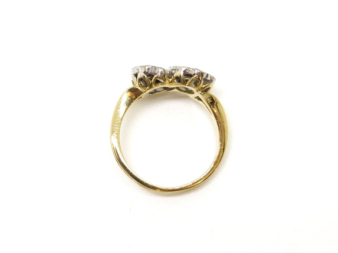 Lovely vintage 18ct gold double flower ring, one flower set with an oval cut emerald and one set with an oval cut ruby, all surrounded by diamonds.