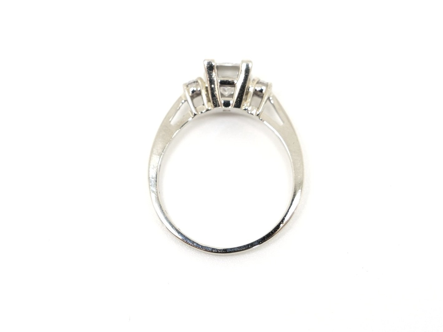 Superb diamond engagement ring, set with a GIA certified 1ct G colour and VS1 clarity modified square cut diamond. With a brilliant cut diamond to each shoulder.