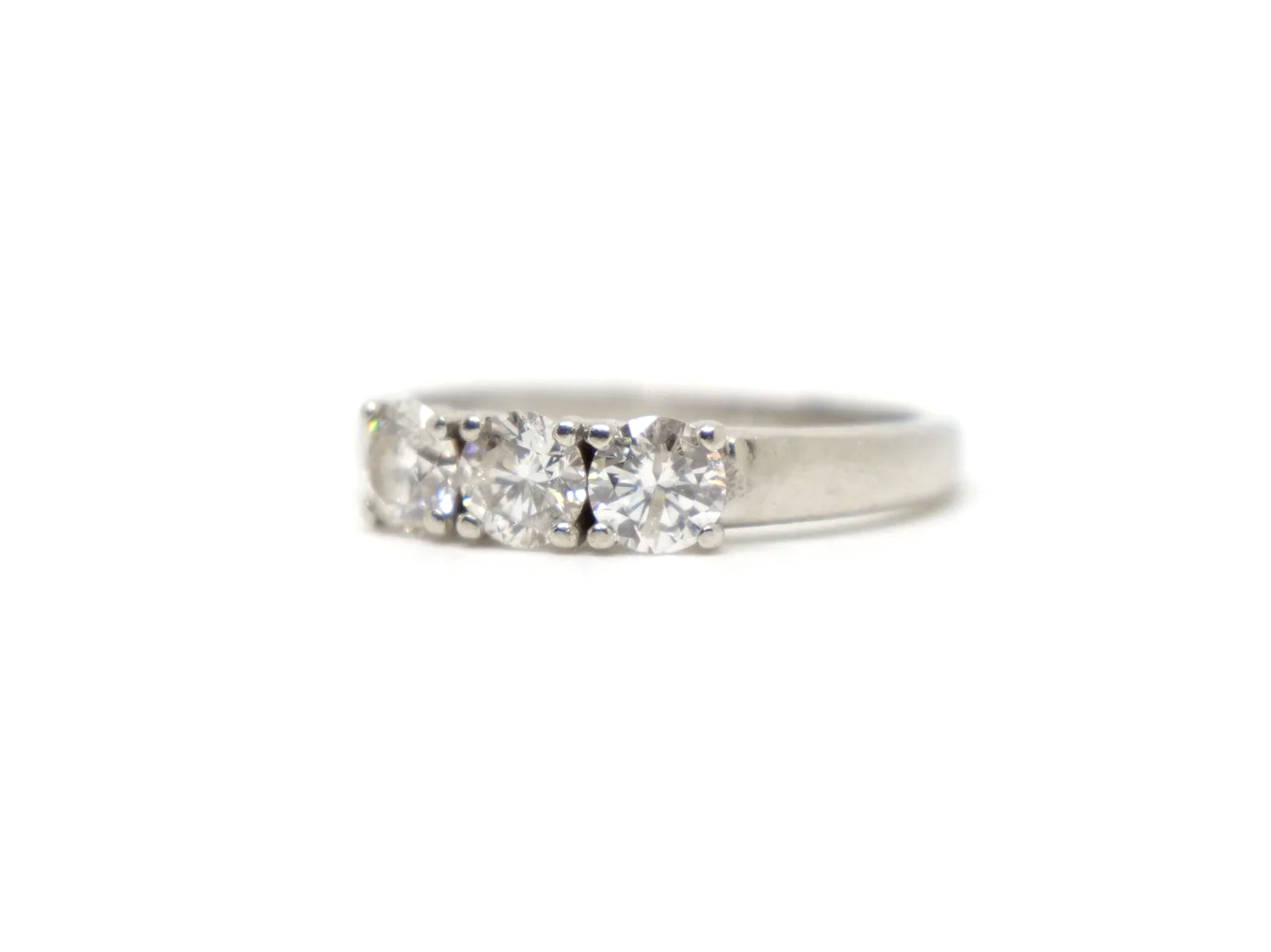 Platinum diamond three stone ring, round brilliant cut diamonds