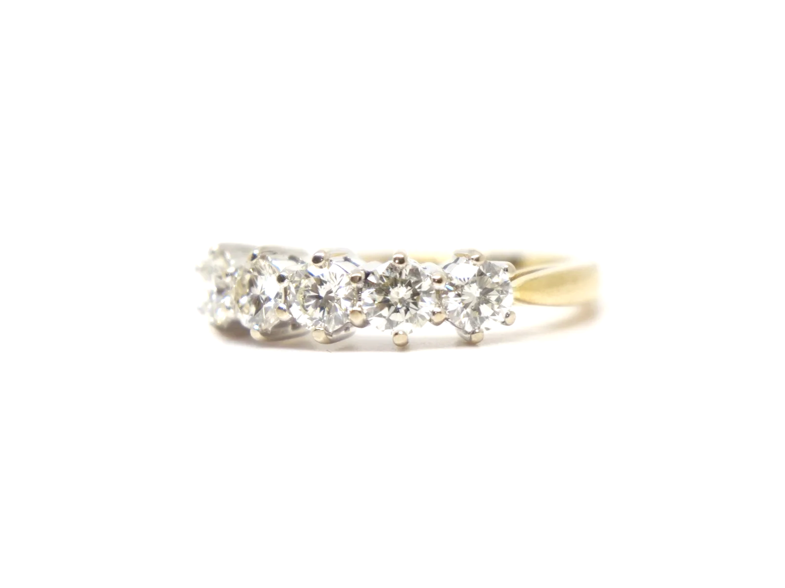 A classic five stone diamond ring in 18ct gold, set with five round brilliant cut diamonds of 1 carat in total.