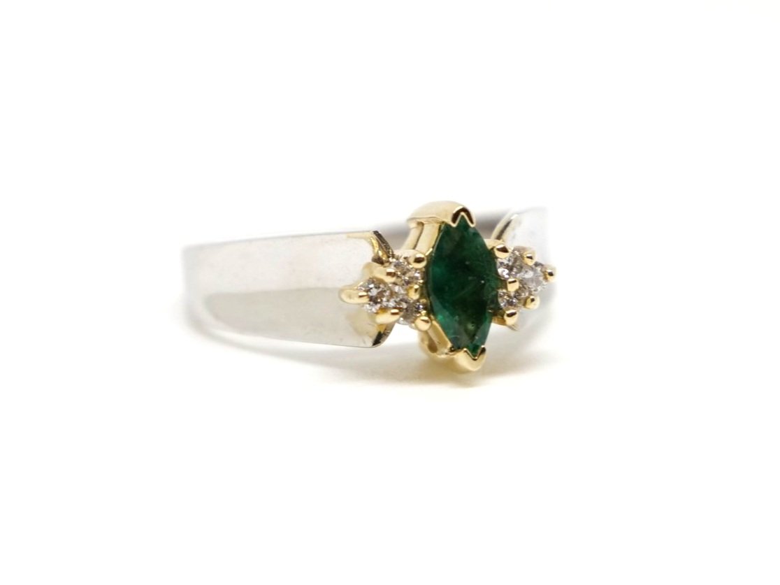 Lovely vintage 14ct gold emerald and diamond ring, set with a central marquise cut emerald with small diamonds to each shoulder.