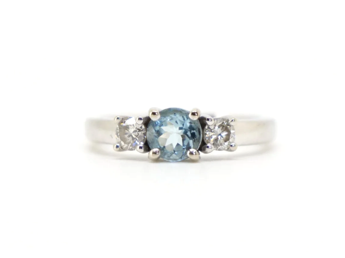 14ct gold aquamarine and diamond three stone ring, round cut aquamarine centre
