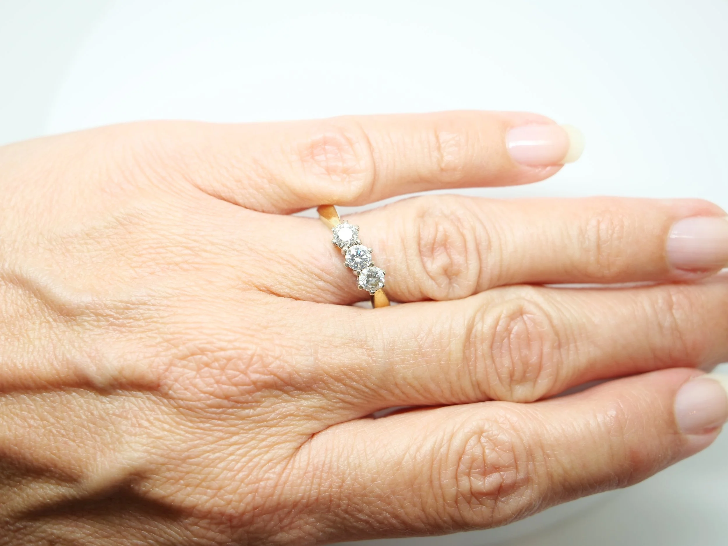 18ct yellow gold three-stone diamond ring