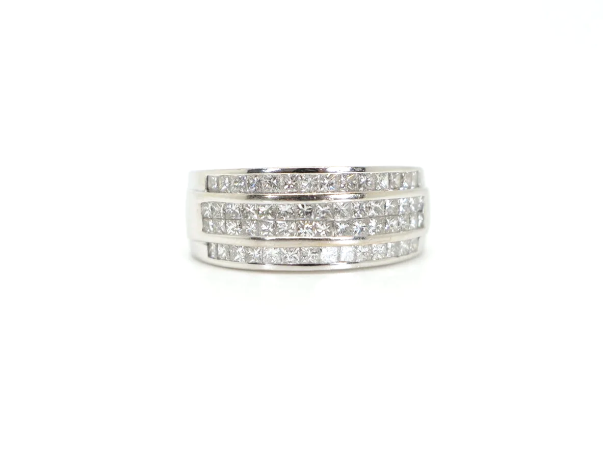 18ct white gold ring with three rows of channel-set princess cut diamonds