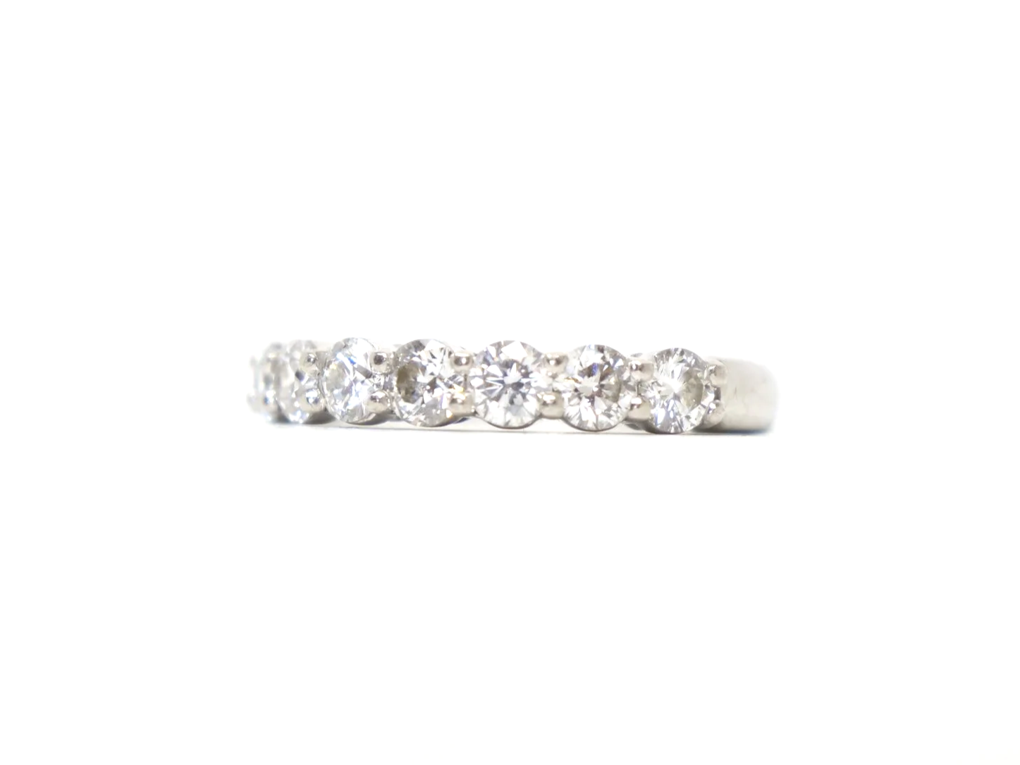 platinum diamond half-eternity ring set with seven round brilliant-cut diamonds