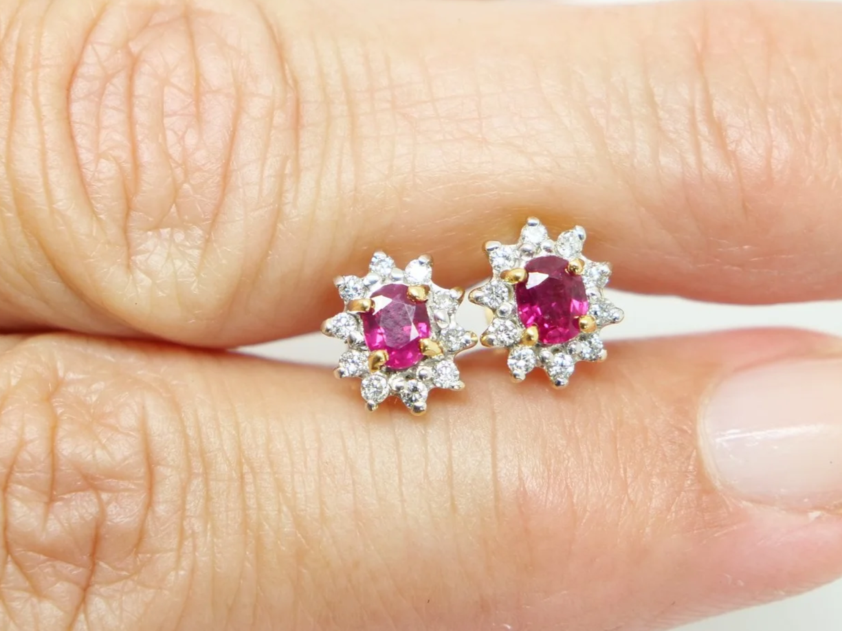 A classic pair of 18ct gold ruby and diamond earrings.