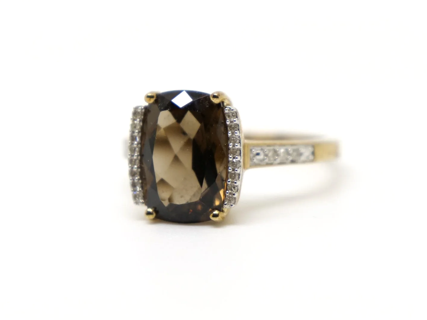 Very pretty 9ct gold smoky quartz and diamond cocktail ring, set with a chequerboard cushion cut smokey quartz and with diamonds to each side and down each shoulder.