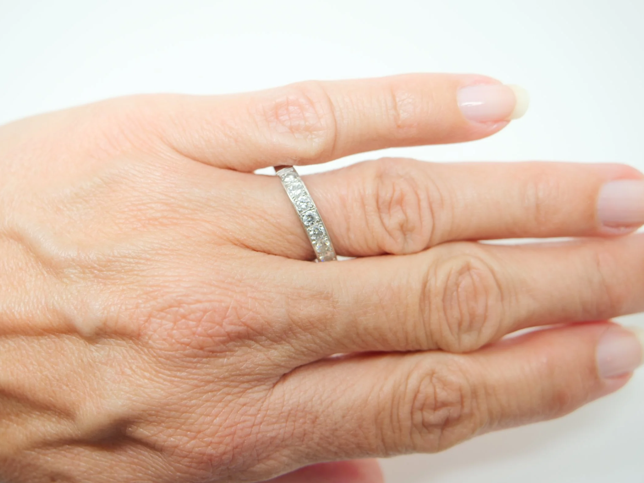 platinum diamond half-eternity ring set with seven round brilliant-cut diamonds