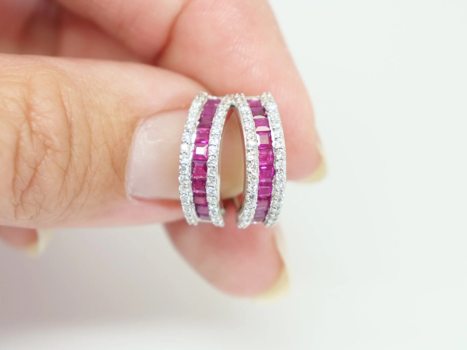 18ct white gold hoop earrings with channel-set rubies bordered by pavé diamonds