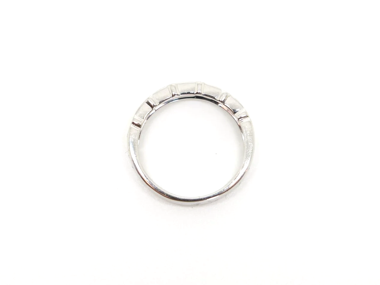 18ct white gold half eternity ring with alternating round and baguette cut diamonds