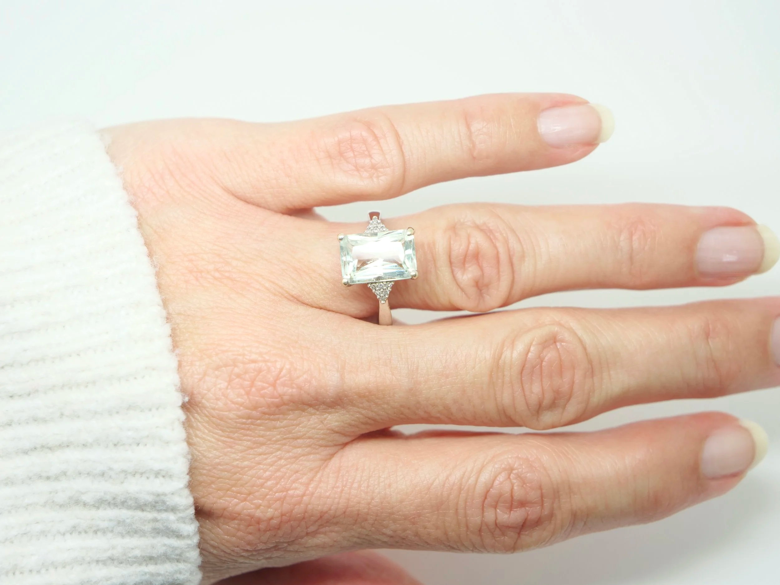 Lovely vintage 9ct gold cocktail ring set with a light green amethyst, with a cluster of small diamonds set to each shoulder.