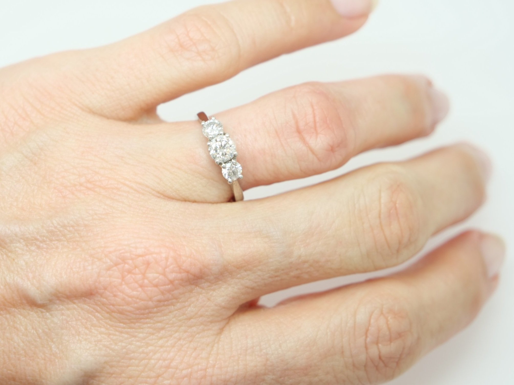 Lovely platinum 1ct diamond three stone ring, set with three brilliant cut diamonds. Centre stone approximately 0.5ct, with a further 0.25ct diamond to each side.