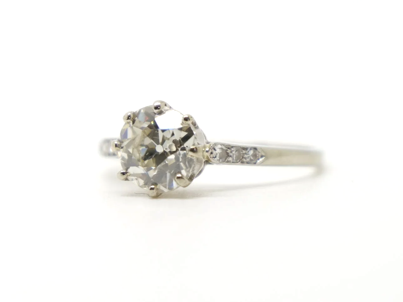 Stunning platinum Art Deco old cut diamond solitaire ring, set with a gorgeous, clear white old cut diamond, with further diamonds to each shoulder.