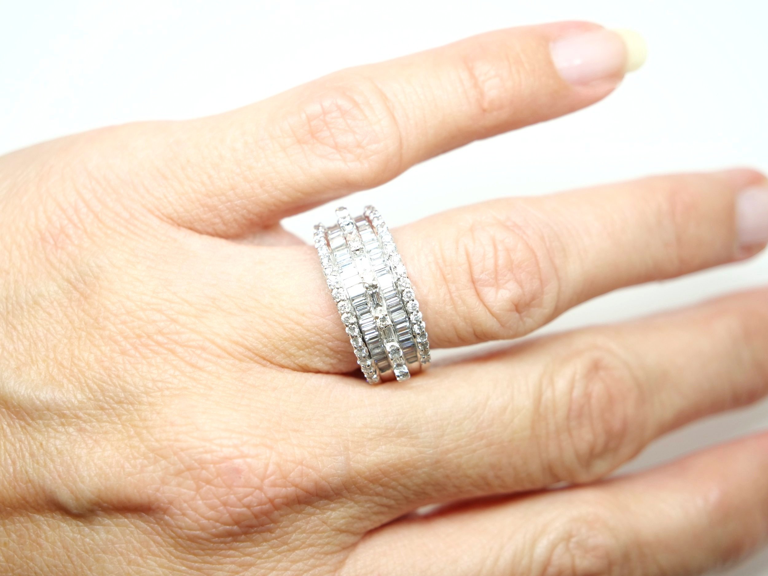 Contemporary 18ct gold diamond statement ring, set with a mixture of both brilliant and baguette cut diamonds. 1.88cts of diamonds.