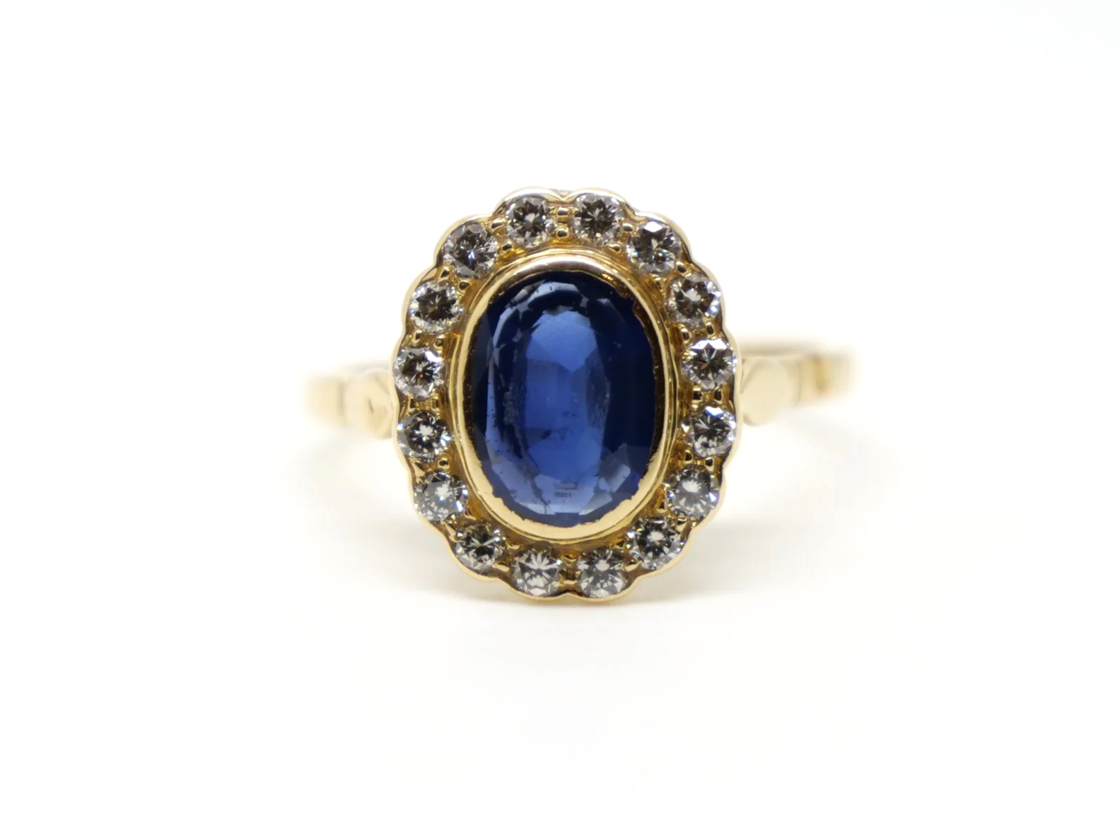Super vintage 18ct gold sapphire and diamond ring, set with a large oval cut sapphire of approximately 1.85ct and surrounded by diamonds.