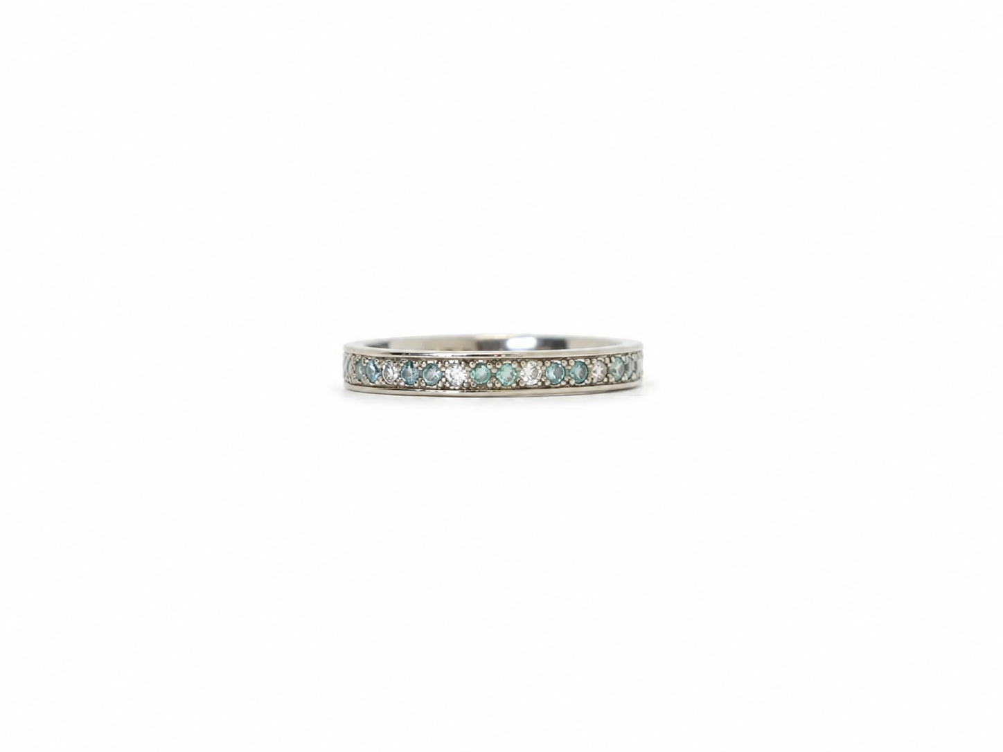 An 18ct white gold eternity ring alternating brilliant-cut white and blue diamonds, 0.59ct total. UK size I½. A rare vintage find, ready to ship.