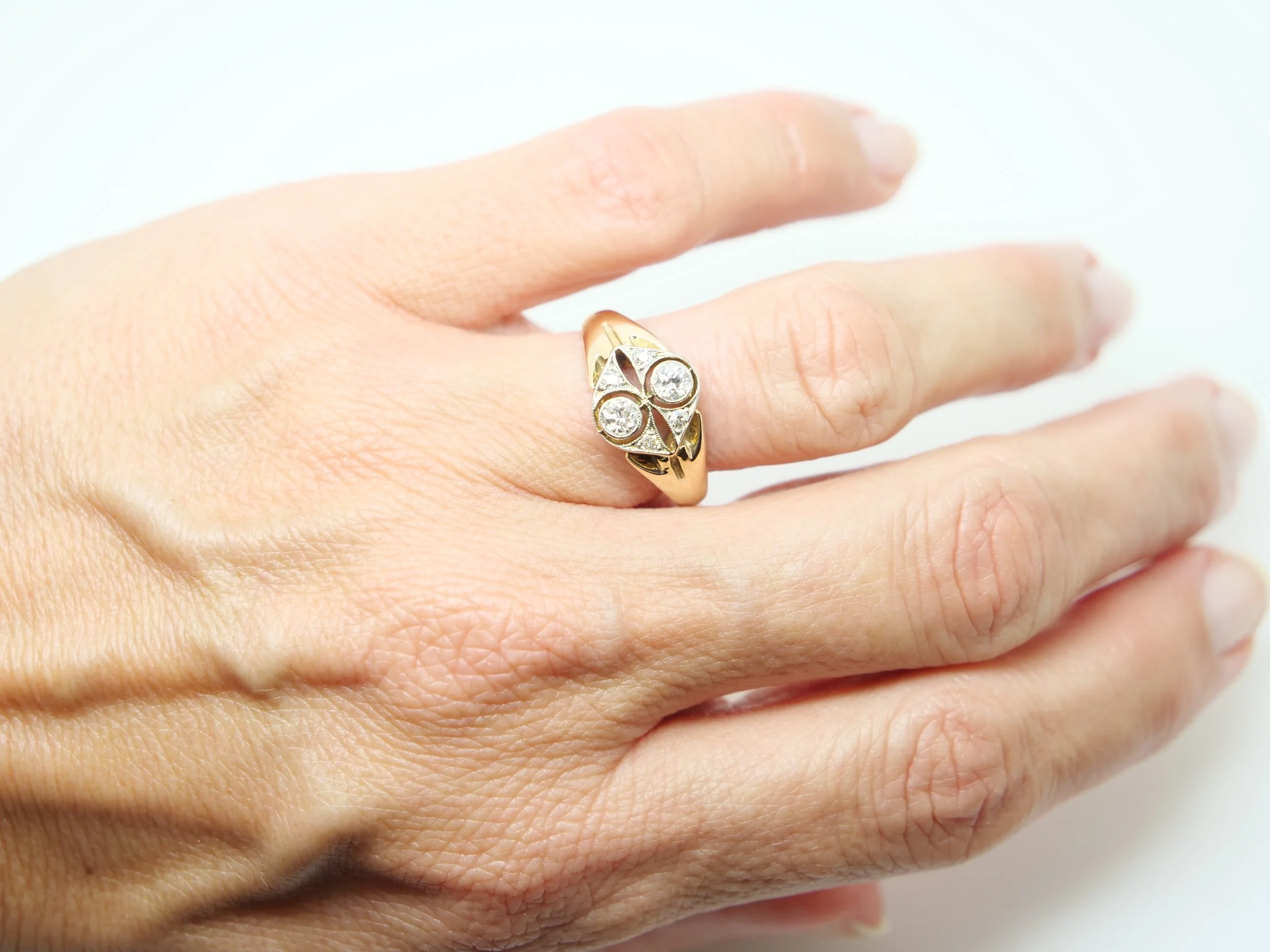 Beautiful 18ct gold Art Deco ring, set with two old cut diamonds in a North South design, with four further diamonds in this lovely design.