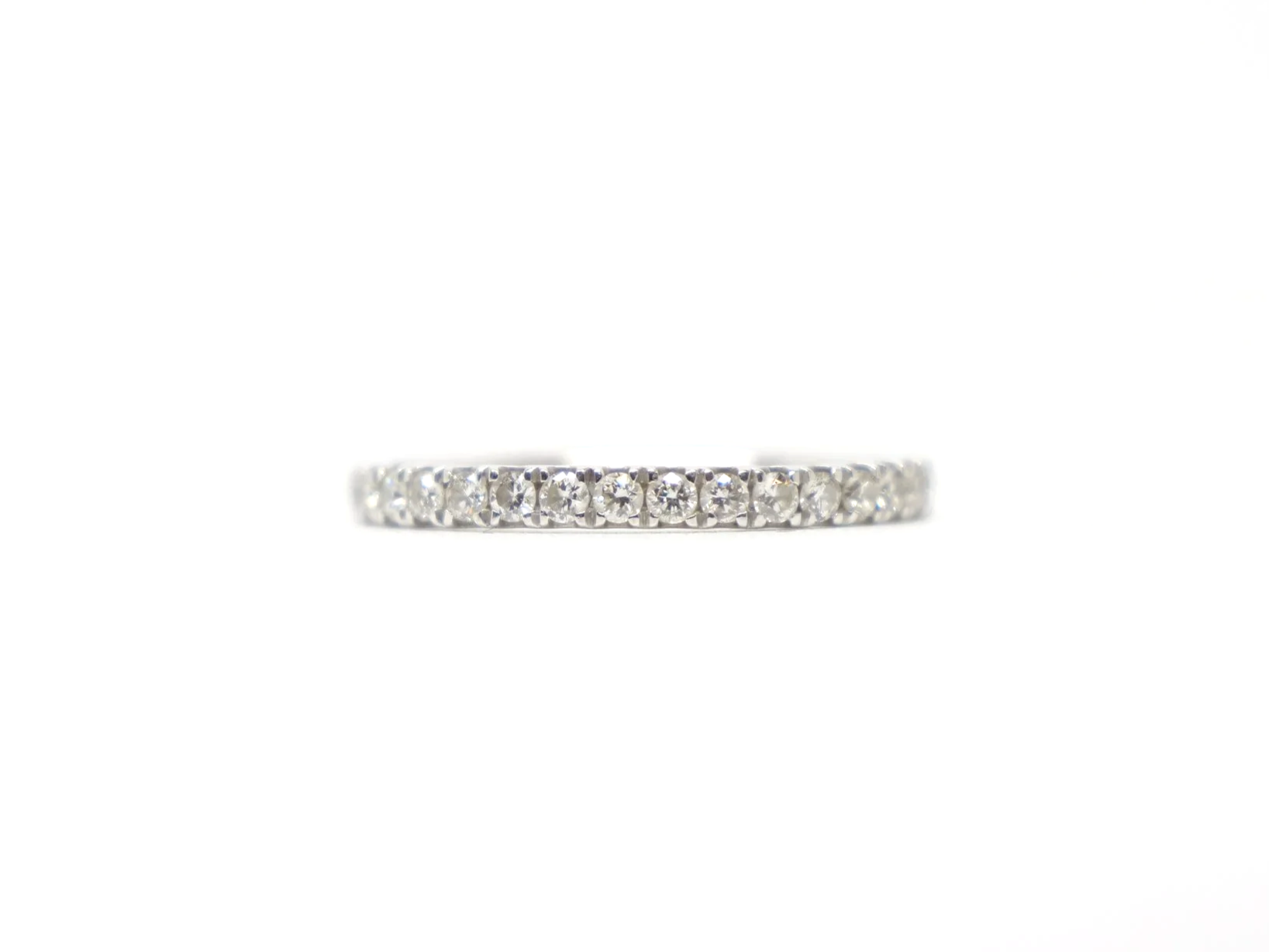 platinum diamond two thirds eternity ring set with round brilliant-cut diamonds pavé-set around the band