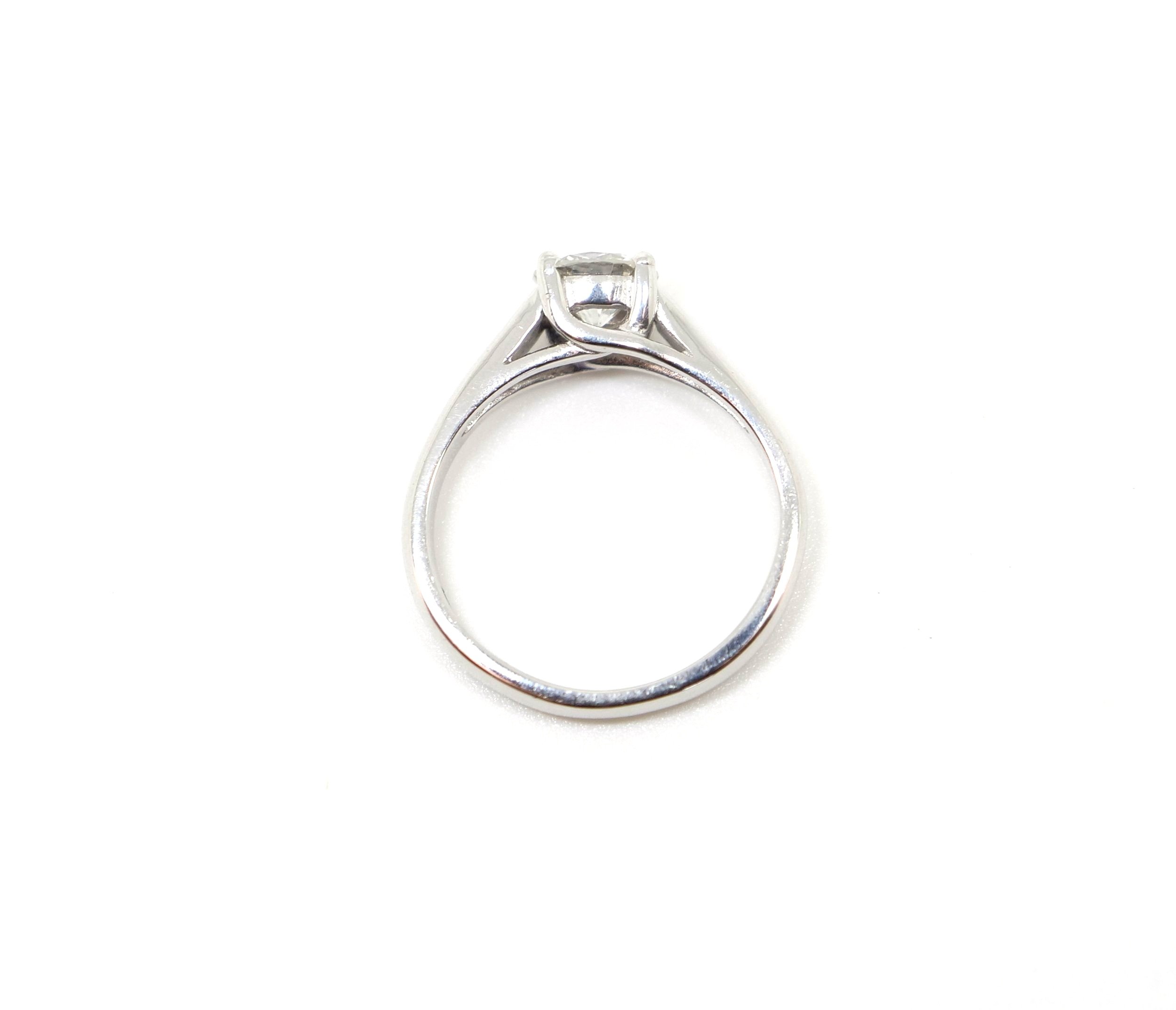 Stunning 18ct gold diamond solitaire ring, set with a beautiful brilliant cut diamond. Lovely unusual setting. Diamond weight approximately 0.93ct.