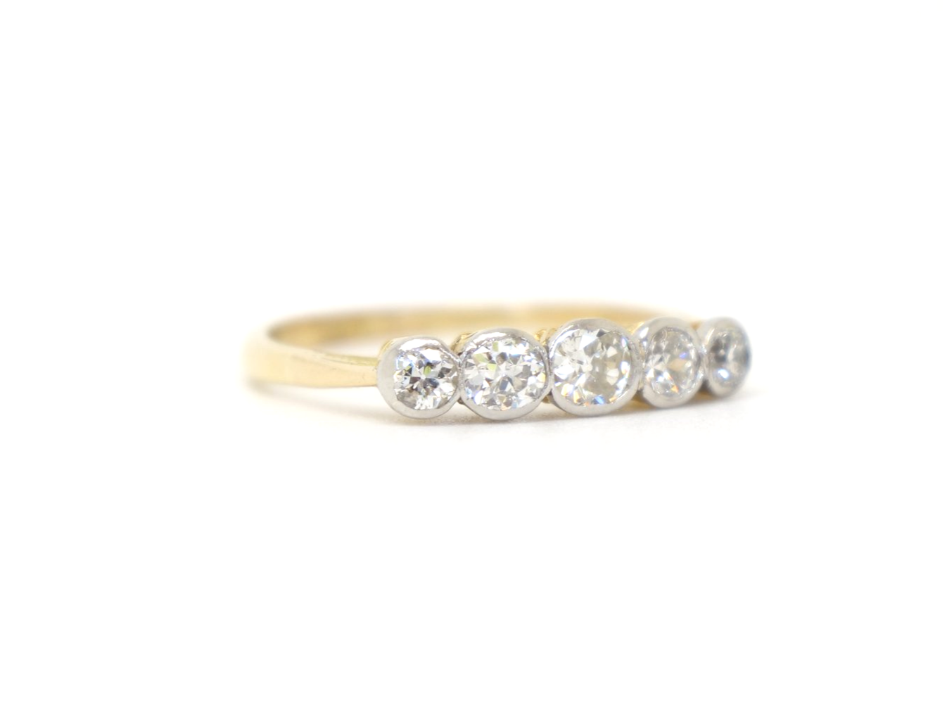 Gorgeous vintage 18ct gold and platinum five stone ring, set with five well matched old cut diamonds. Approximately 0.8cts total diamond weight.
