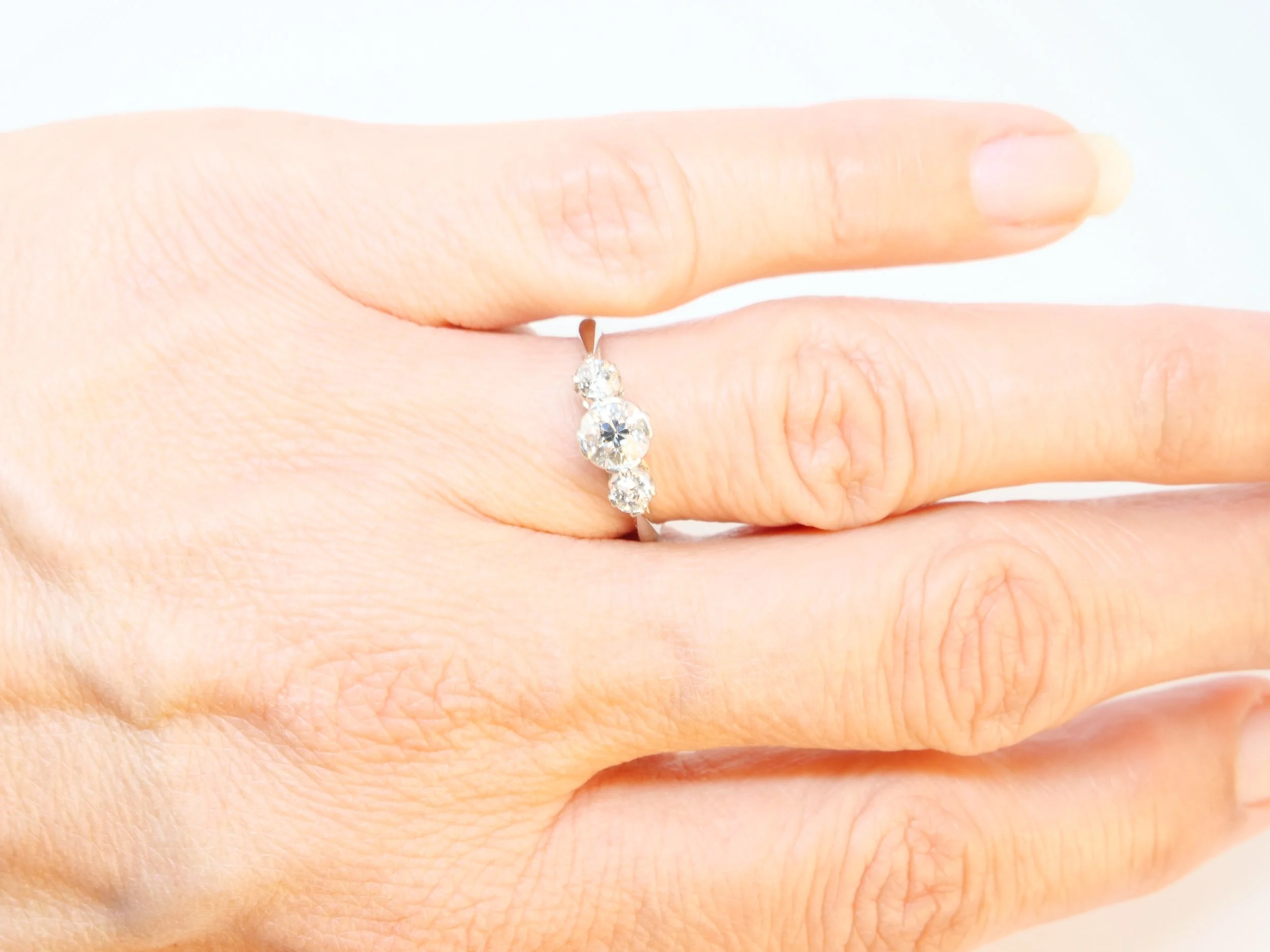 Gorgeous platinum diamond trilogy ring, set with three old cut diamonds in this lovely graduated style. Centre diamond approximately 0.5ct, total diamonds approximately 0.75ct.