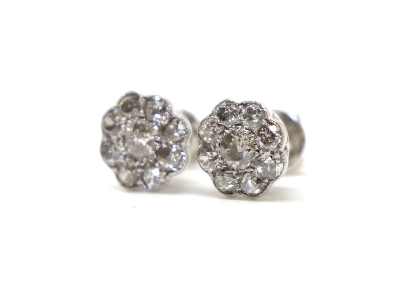 Beautiful 18ct gold old cut diamond earrings in a flower / daisy design, each set with nine old cut diamonds. With 18ct gold butterfly backs.