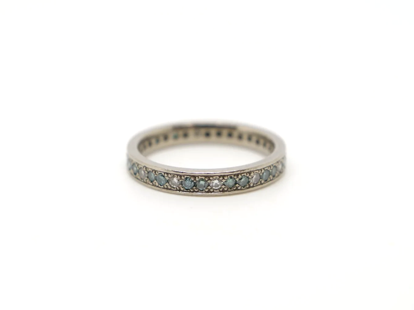 An 18ct white gold eternity ring alternating brilliant-cut white and blue diamonds, 0.59ct total. UK size I½. A rare vintage find, ready to ship.