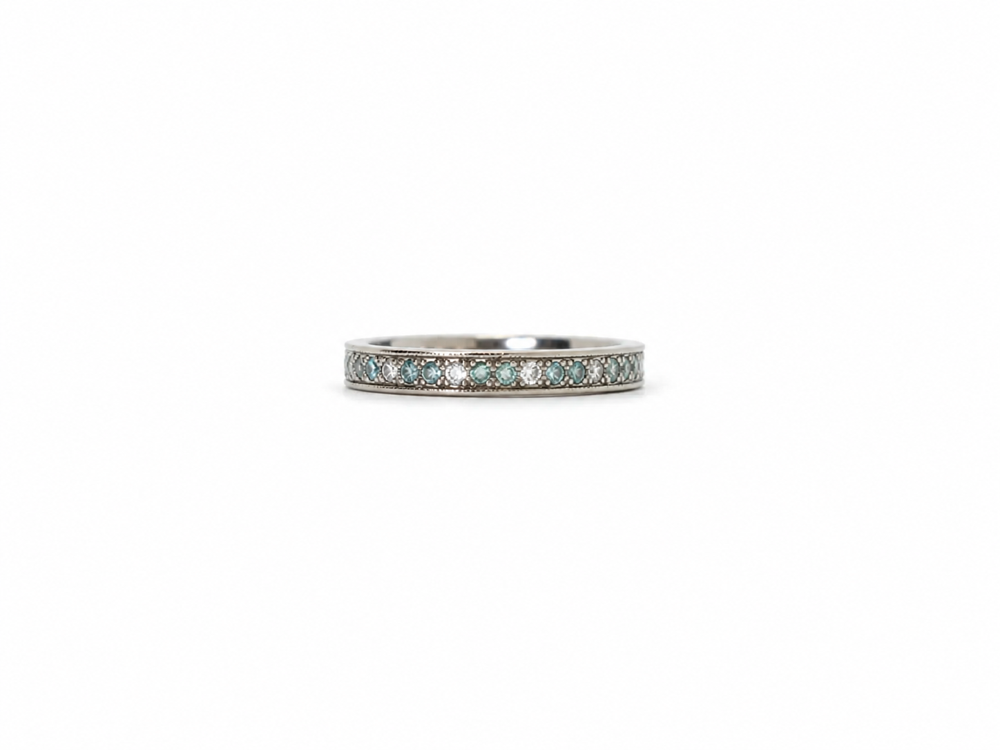 An 18ct white gold eternity ring alternating brilliant-cut white and blue diamonds, 0.59ct total. UK size I½. A rare vintage find, ready to ship.