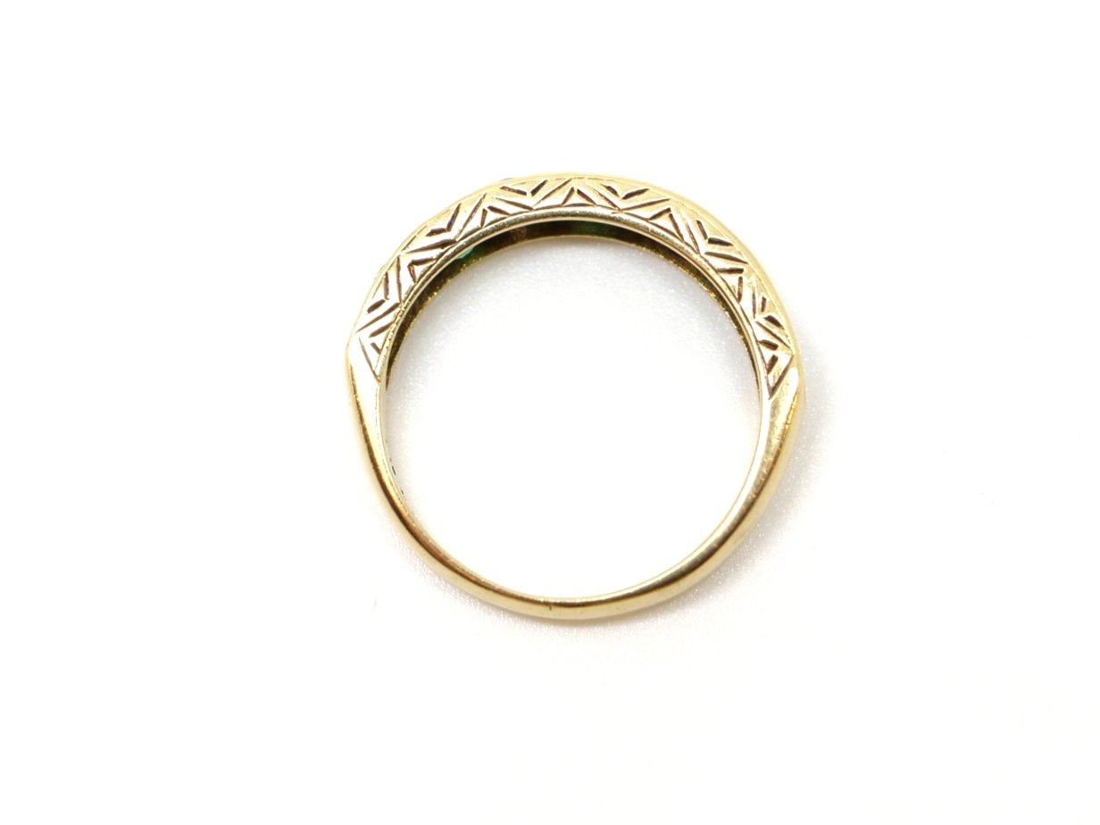 Lovely vintage 18ct gold emerald and diamond half eternity ring, set with four brilliant cut diamonds and five emeralds. Scroll detail to top and bottom.