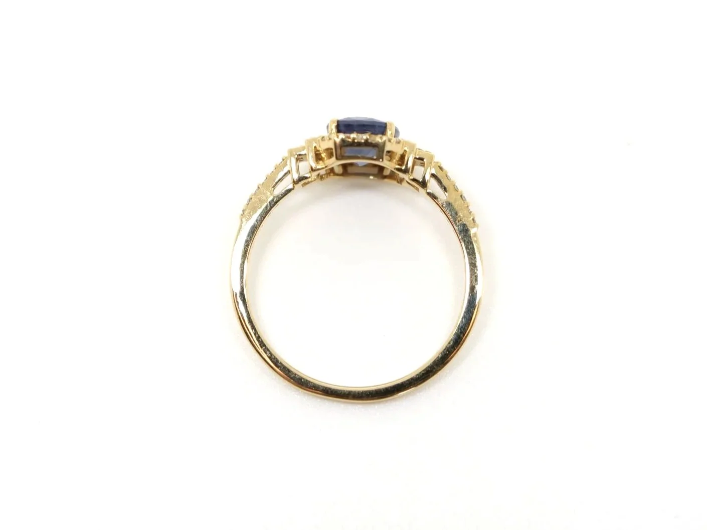 14ct gold sapphire and diamond halo ring, oval blue sapphire with Art Deco style diamond shoulders, UK size N½