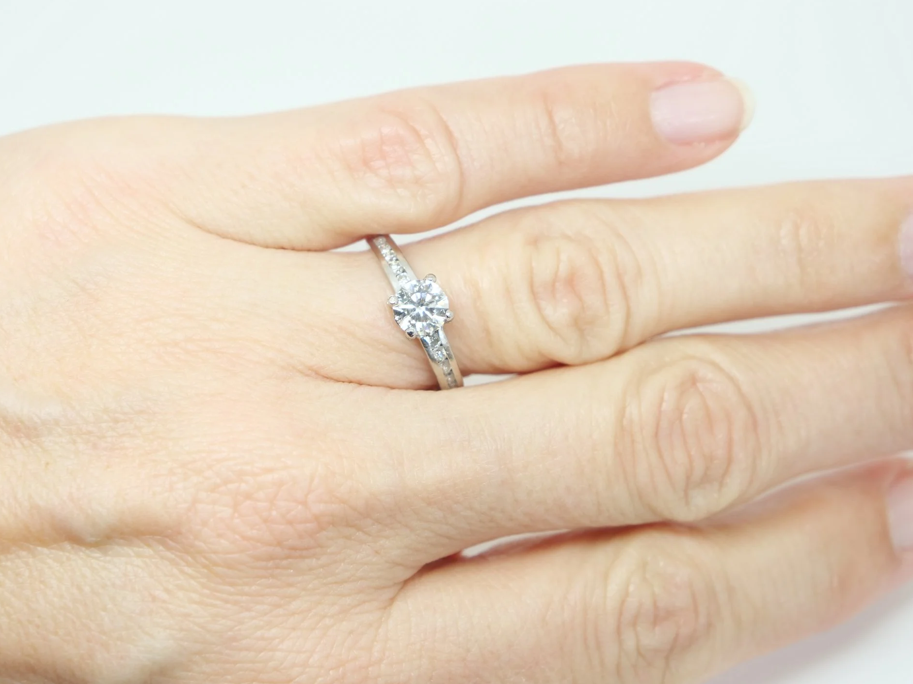 Classic 18ct gold diamond solitaire ring, set with a lovely approximately 0.75ct centre diamond, with diamonds to each shoulder.